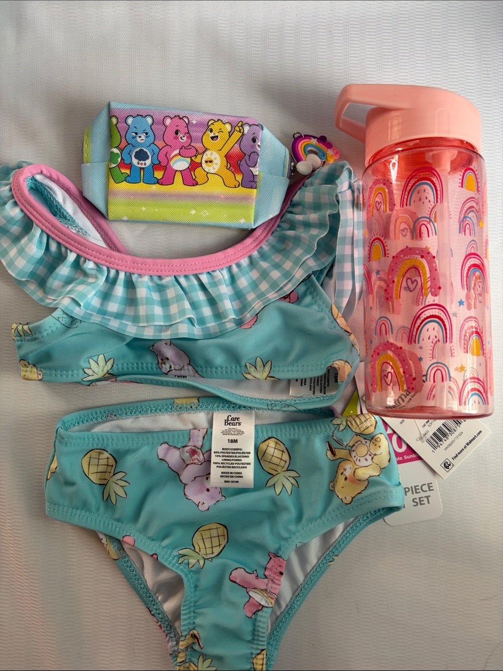 Care Bears swimwear and care bear coin pouch and a 16oz water bottle Bundle NWT